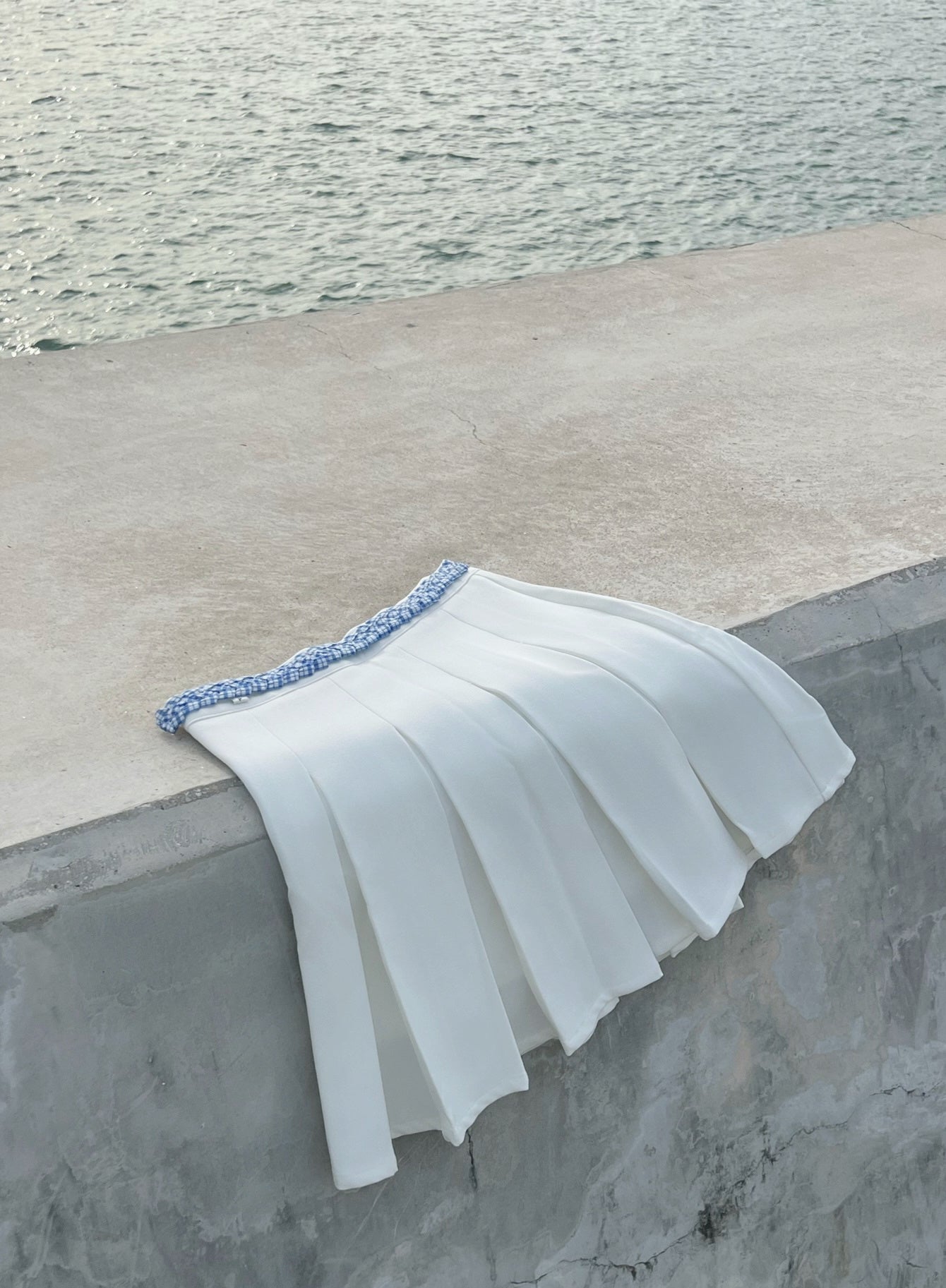 Patchy - White Pleated Mini Skirt with Blue and White Plaid Twisted Strap